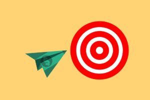 Grafica con aereo di carta e obiettivo